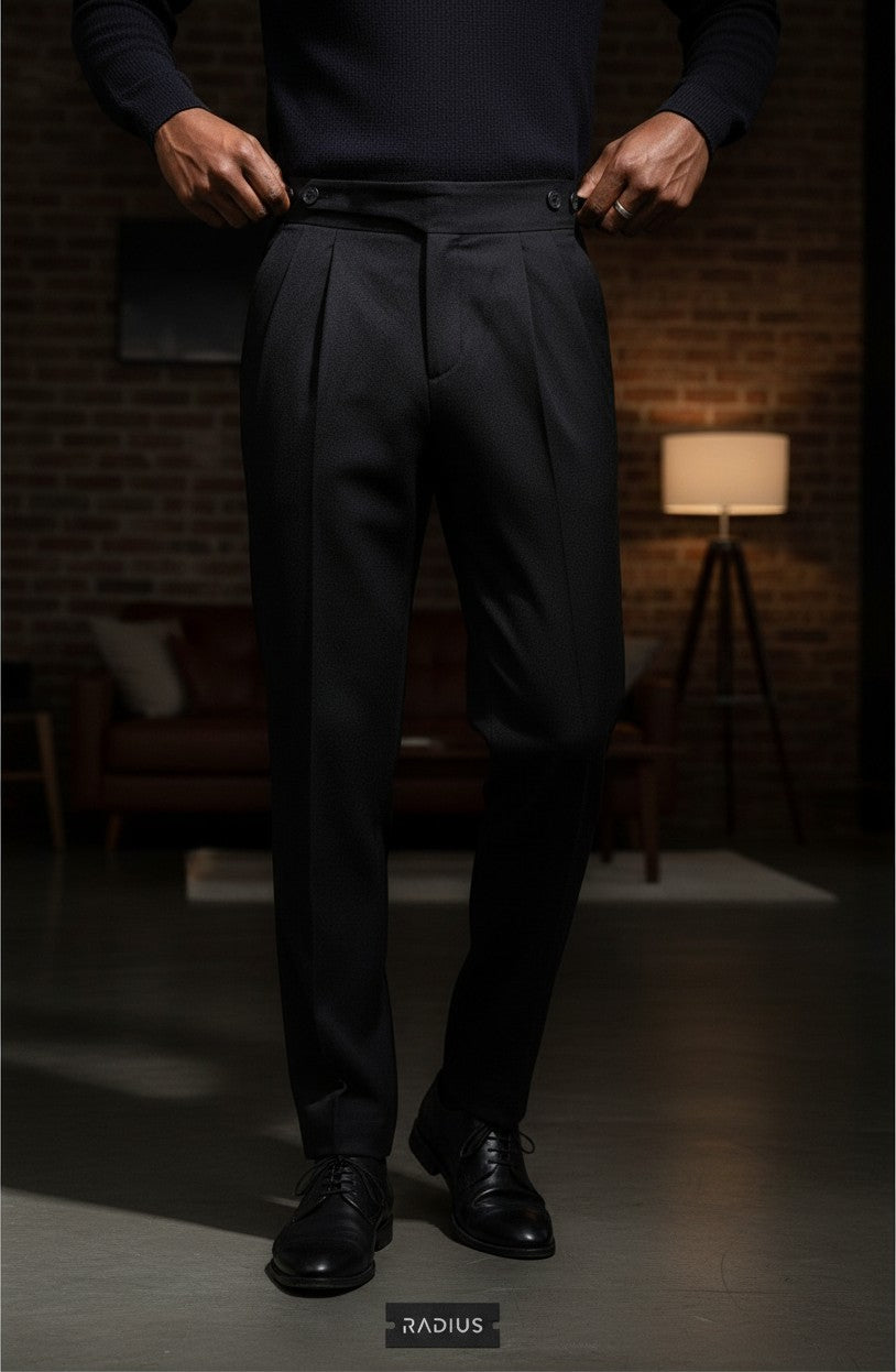 RADIUS Signature black Gurkha trousers featuring a high-waisted interlocking waistband and sharp front pleats.
