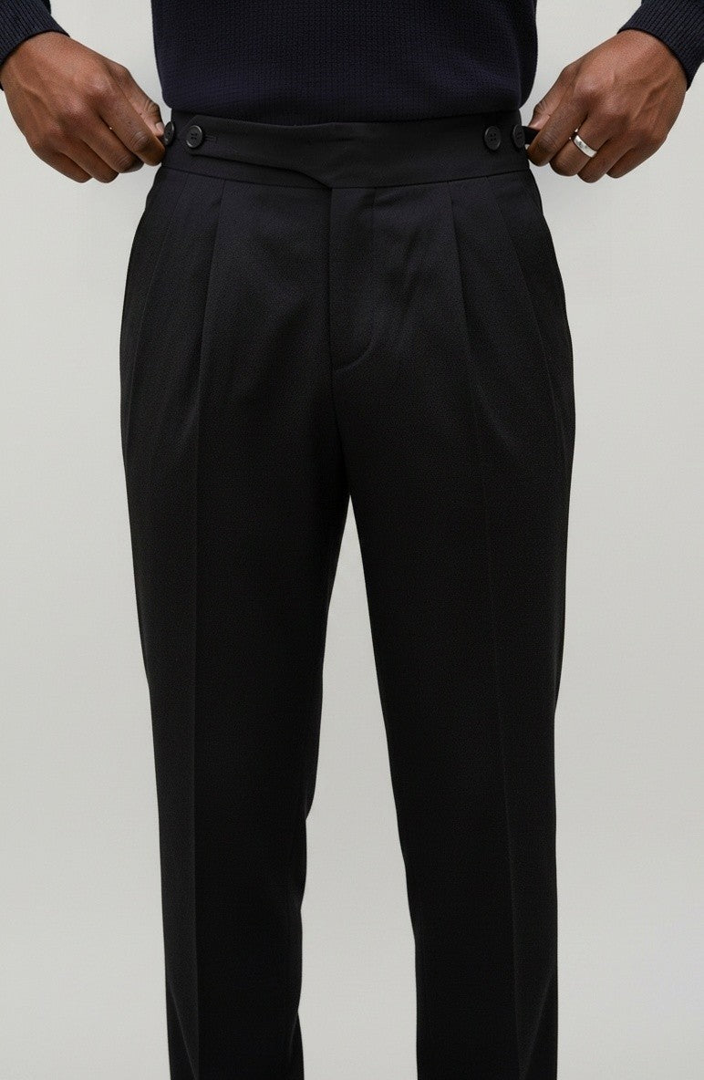 RADIUS Signature black Gurkha trousers featuring a high-waisted interlocking waistband and sharp front pleats.